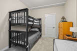 This cozy bedroom features a stylish bunk bed, perfect for kids or guests.