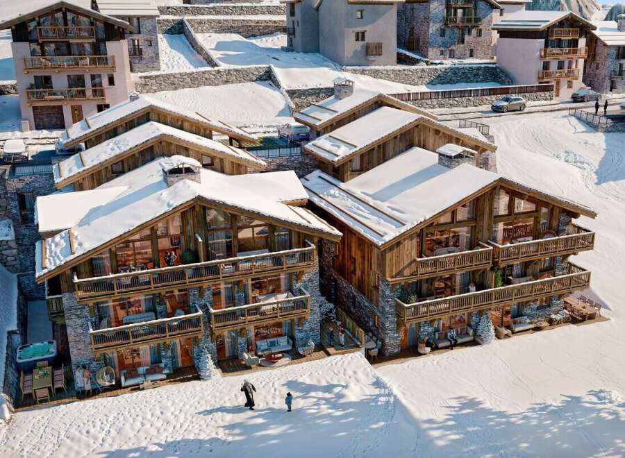 Experience luxury living in this stunning chalet nestled in a snowy mountain landscape.
