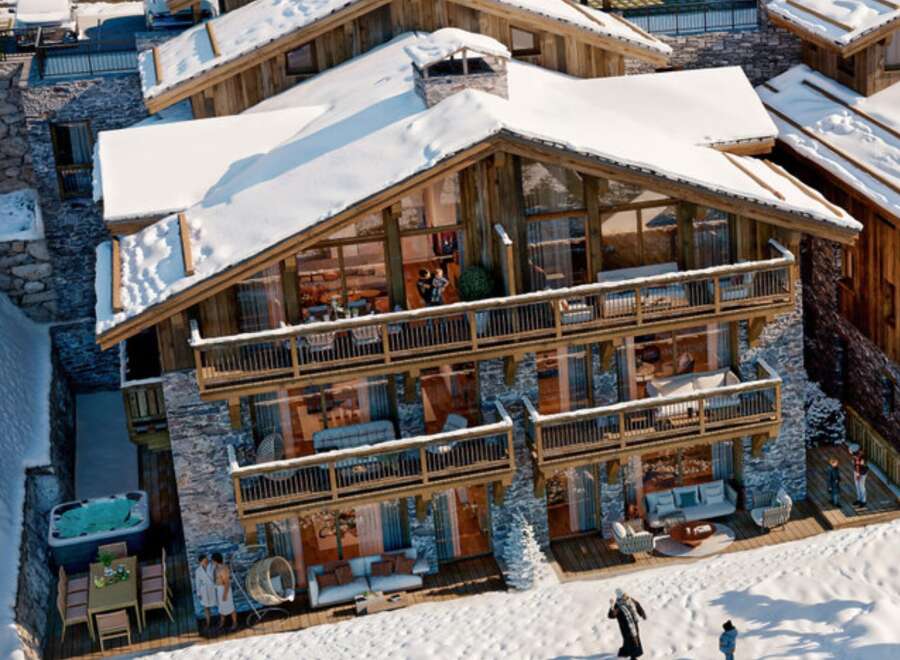 Experience luxury living in this stunning chalet nestled in a snowy landscape.