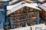 Experience luxury living in this stunning chalet nestled in a snowy landscape.