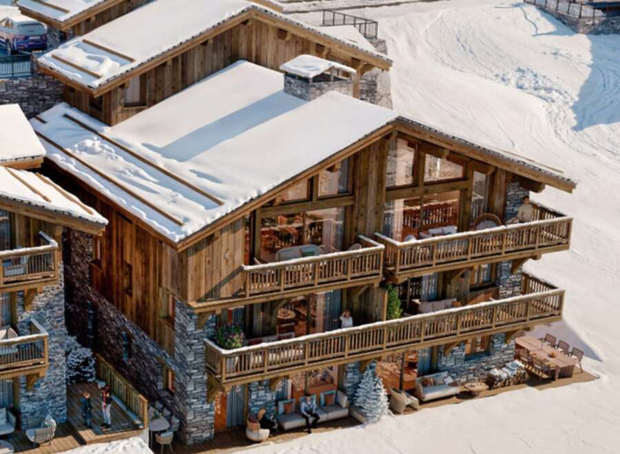 Experience luxury living in this stunning chalet nestled in a snowy landscape.