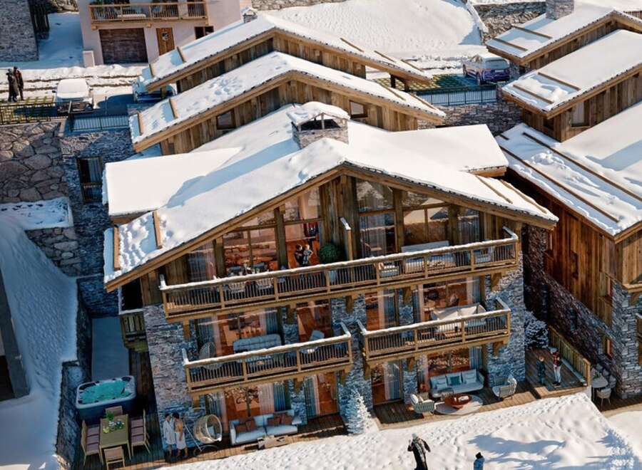 Experience luxury living in this stunning chalet nestled in a snowy landscape.