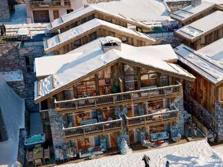 Experience luxury living in this stunning chalet nestled in a snowy landscape.