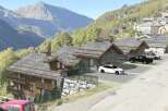 Discover the charm of this stunning mountain property, featuring traditional stone and wood architecture.