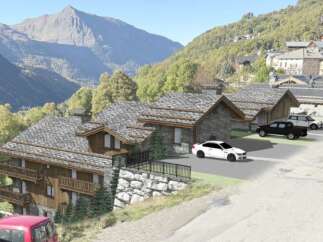 Discover the charm of this stunning mountain property, featuring traditional stone and wood architecture.