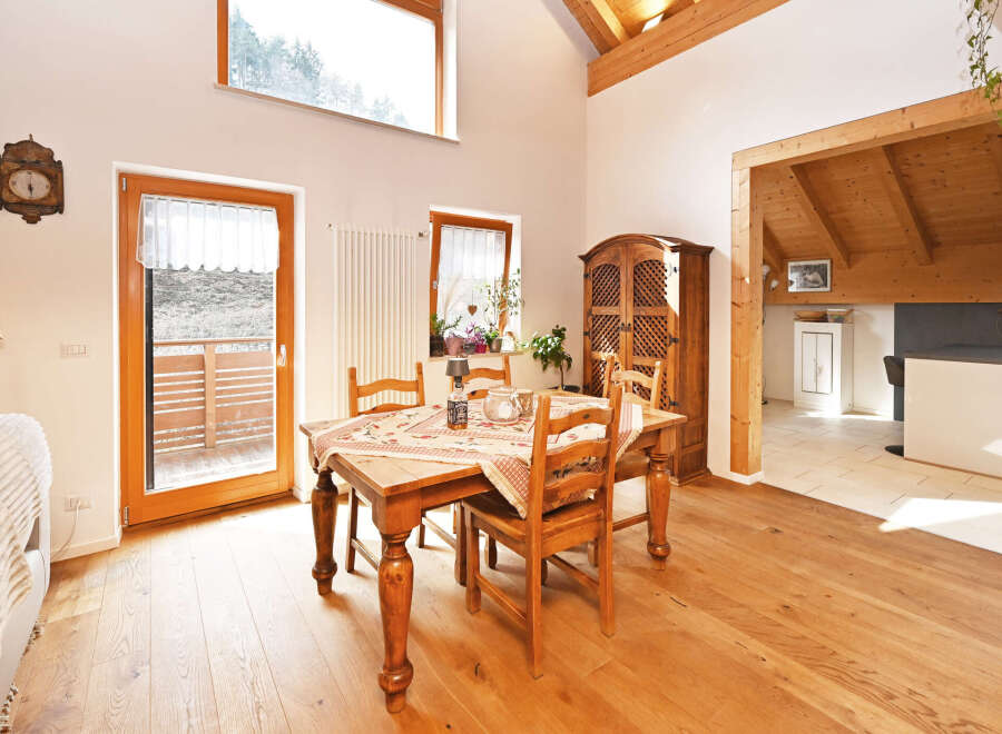 This charming dining room boasts a warm and inviting atmosphere, perfect for family gatherings and entertaining.