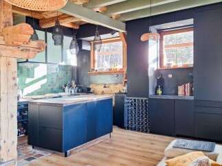Discover this stunning property featuring a modern kitchen with a stylish island and ample storage.
