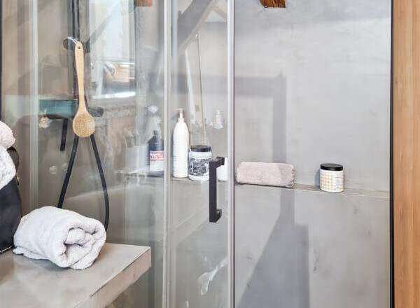 Step into luxury with this stunning bathroom featuring a modern shower design.