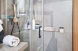 Step into luxury with this stunning bathroom featuring a modern shower design.