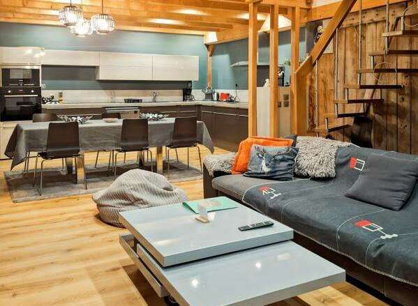 Discover the charm of this stunning property, featuring a beautifully designed interior with exposed wooden beams and a modern kitchen.