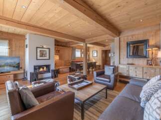 This stunning living room boasts a cozy fireplace, perfect for chilly evenings.