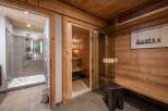 Step into luxury with this stunning property featuring a private sauna and a modern shower.