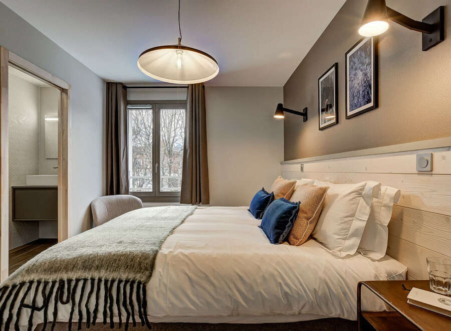 Experience the epitome of comfort in this stylish bedroom.