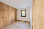 This stunning room features beautiful wooden paneling and flooring, creating a warm and inviting atmosphere.