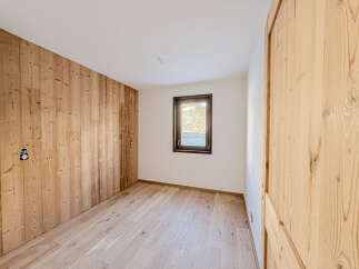 This stunning room features beautiful wooden paneling and flooring, creating a warm and inviting atmosphere.