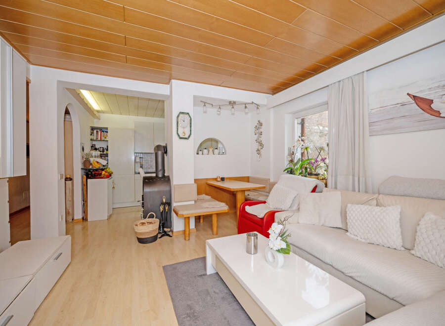 This charming living space features a cozy seating area with a comfortable sofa and a stylish coffee table.