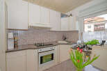 This charming kitchen offers a cozy and functional space, perfect for culinary enthusiasts.