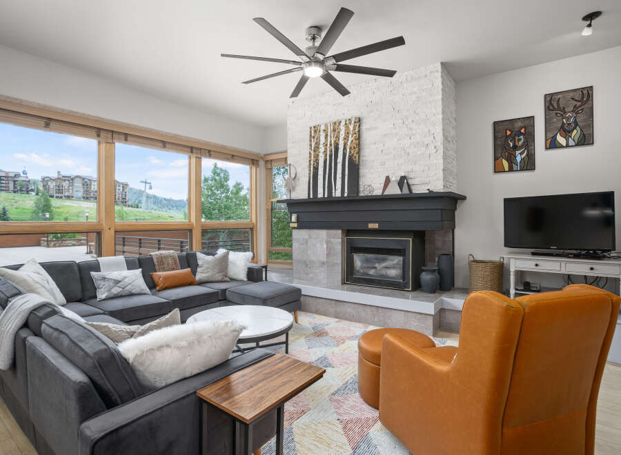 This stunning living room boasts a cozy fireplace, perfect for chilly evenings.