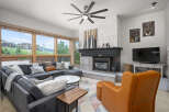 This stunning living room boasts a cozy fireplace, perfect for chilly evenings.