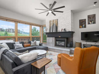 This stunning living room boasts a cozy fireplace, perfect for chilly evenings.