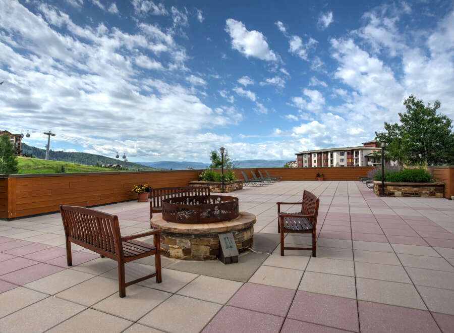 Enjoy the stunning mountain views from this luxurious outdoor patio.