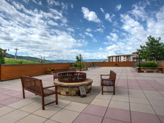 Enjoy the stunning mountain views from this luxurious outdoor patio.