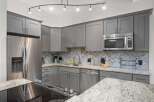 This stunning kitchen boasts modern design and functionality.