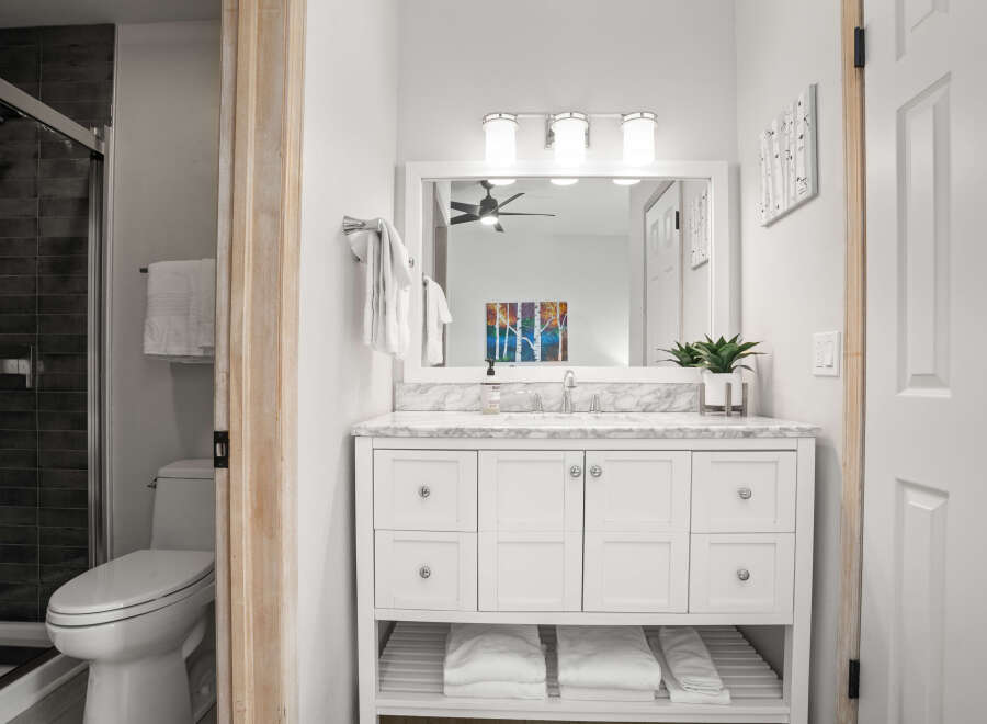Step into a bright and inviting bathroom, showcasing a modern vanity with ample storage.