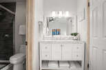 Step into a bright and inviting bathroom, showcasing a modern vanity with ample storage.