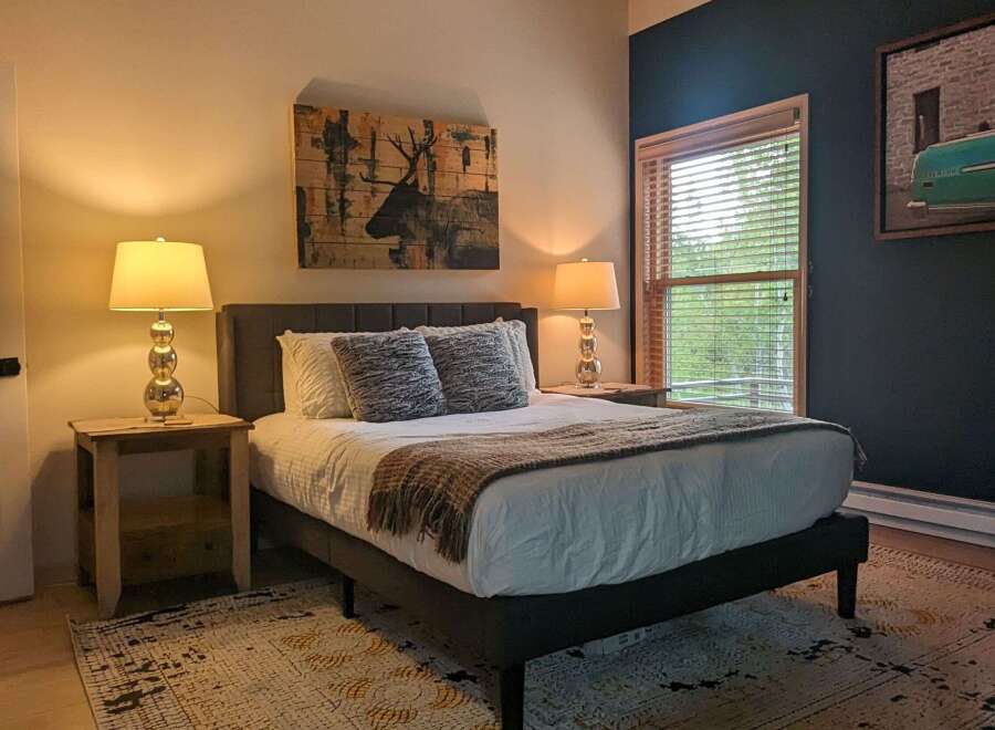 This inviting bedroom features a comfortable bed, perfect for relaxation.