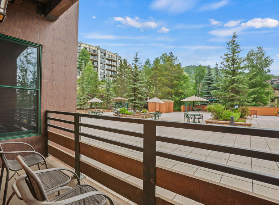 Enjoy breathtaking views from this stunning property! This outdoor space features a patio with seating, perfect for relaxing or entertaining.