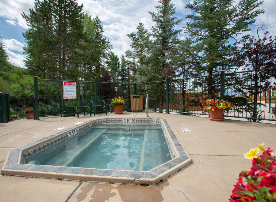 Enjoy a relaxing soak in this inviting hot tub, perfect for unwinding after a long day.