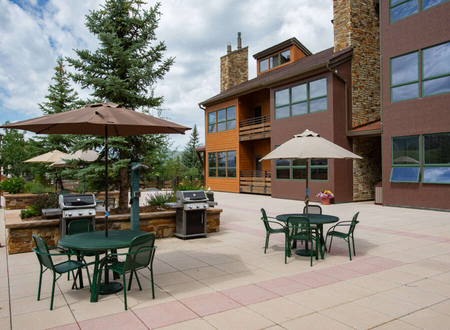 Enjoy outdoor living at its finest with this stunning property featuring a spacious patio and inviting seating areas.