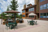 Enjoy outdoor living at its finest with this stunning property featuring a spacious patio and inviting seating areas.