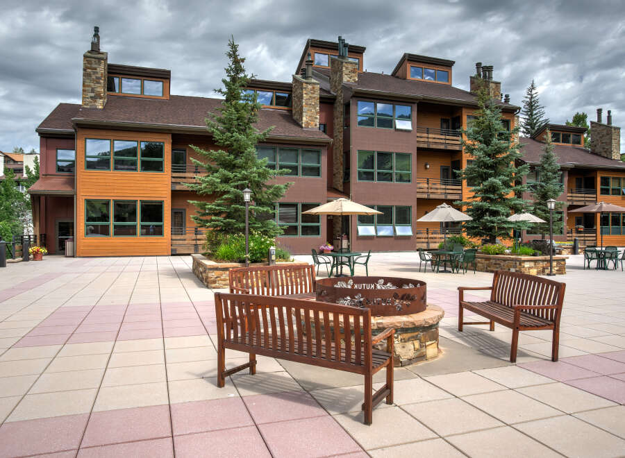 Discover the charm of this stunning property, featuring a beautifully designed exterior with a mix of wood and stone accents.
