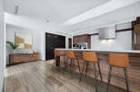 This stunning kitchen boasts a modern design with sleek cabinetry and a spacious island.