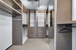 Step into luxury with this meticulously designed walk-in closet.