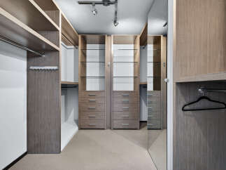 Step into luxury with this meticulously designed walk-in closet.