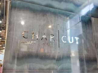 Discover the charm of this unique property, featuring a stylish 'CHAR CUT ROAST HOUSE' sign.