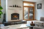 Cozy up in this stunning living room, featuring a beautiful fireplace perfect for those chilly evenings.