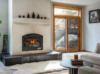 Cozy up in this stunning living room, featuring a beautiful fireplace perfect for those chilly evenings.