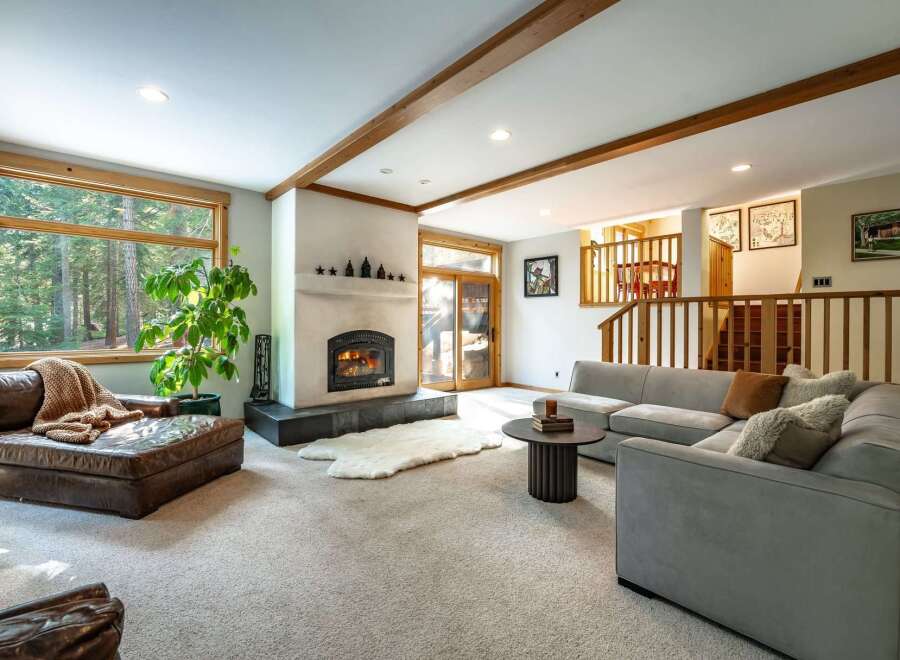 This stunning living room boasts a cozy fireplace, perfect for those chilly evenings.