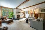 This stunning living room boasts a cozy fireplace, perfect for those chilly evenings.
