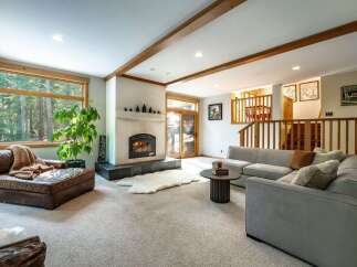 This stunning living room boasts a cozy fireplace, perfect for those chilly evenings.