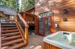 Enjoy luxury living with this stunning property featuring a private hot tub and a beautiful wooden deck.