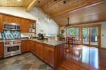 This stunning kitchen boasts a warm and inviting atmosphere, perfect for culinary enthusiasts.
