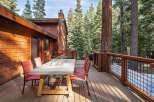 Enjoy the tranquility of this stunning property featuring a spacious deck perfect for outdoor dining and relaxation.