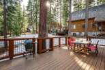 Enjoy the tranquility of this stunning property with a spacious deck, perfect for outdoor gatherings.