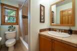 This charming bathroom features a bright window that allows natural light to flood the space.