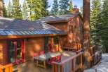 Nestled in a serene wooded setting, this stunning property boasts a beautiful wooden exterior and a spacious deck perfect for entertaining.